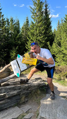 Tourist on the top of Mount Kovadlo, Eastern Sudetes, Polish-Czech border