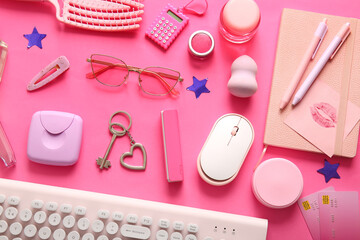 Composition with female accessories, cosmetics, credit cards and gadgets on pink background