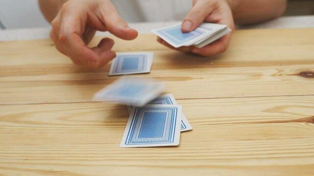 hands deal playing cards before the game. gambling. A board game for spending leisure time with friends and family.