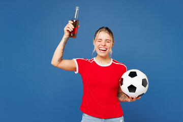 Young winner woman fan wear basic red t-shirt cheer up support football sport team hold in hand...