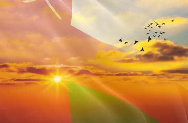 Waving the flag of Oman against the background of a sunset or sunrise. Oman flag for Independence Day. The symbol of the state on wavy fabric.