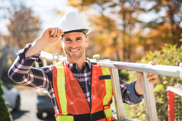 inspector or engineer with ladder checking the building structure and house roof specifications.