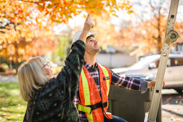 man with hard hat talking with customer