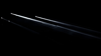 White light beam on a black background, with light from the side, a spotlight, and light streaks and rays