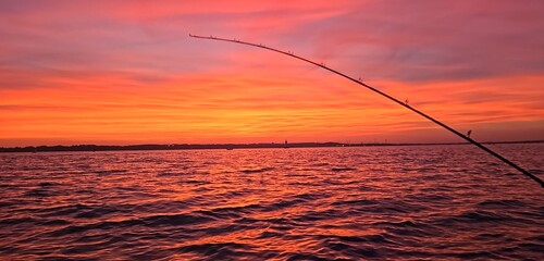 fishing at sunset