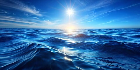 Obraz premium A radiant sun casting its golden rays upon the vast expanse of the ocean, creating a breathtaking spectacle of light and shadow on the undulating waves.