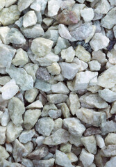 Close-up of small rough stones. Stone background vertical image.