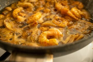 Close-up of mini shrimp cooking in a pan