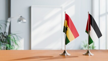 FLAGS OF GHANA AND JORDAN ON TABLE