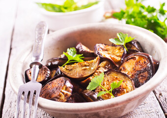 fried egg plant with fresh greens