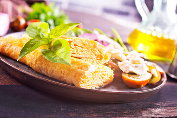 omelette with cherry tomatoes, parsley. and grated cheese