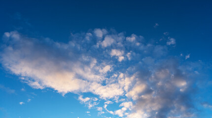 Obraz premium Sky background. Blue evening sunset sky with clouds.