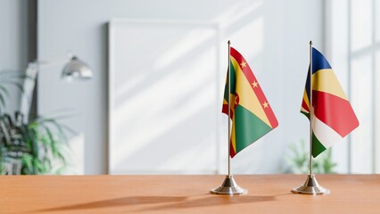 FLAGS OF GRENADA AND SEYCHELLES ON TABLE