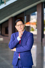 Smart portrait asian businessman in blue navy suit at royal sport club for business person concept.