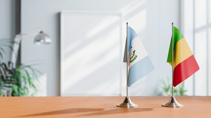 FLAGS OF GUATEMALA AND MALI ON TABLE