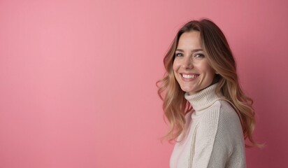 Fototapeta premium Cheerful Woman with Radiant Smile Posing Against Pink Background with Copy Space