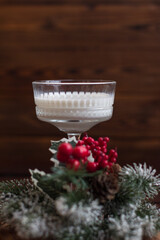 New Year's milk drink in glass glasses, Fir branches, New Year holiday