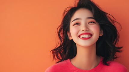 Fototapeta premium Happy young Asian model, half-body view, eyes full of joy, posing against a plain colored