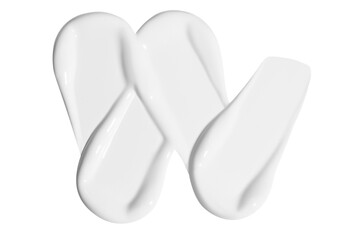 Composition of white cream smears on an empty background. Skincare product, soft and smooth textures.