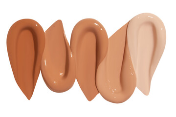 Composition of foundation cream smears in various shades on an empty background. Makeup product, smooth and blendable textures.
