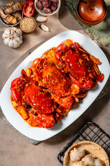 Crab sauce padang (Indonesian Kepiting Saus Padang). dish of crab served in hot and spicy Padang sauce.