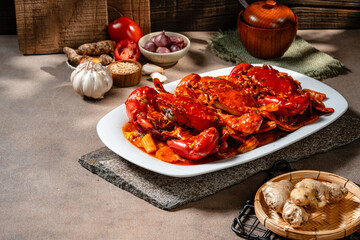 Crab sauce padang (Indonesian Kepiting Saus Padang). dish of crab served in hot and spicy Padang sauce.