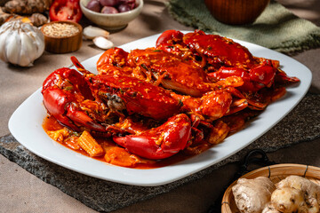 Crab sauce padang (Indonesian Kepiting Saus Padang). dish of crab served in hot and spicy Padang sauce.