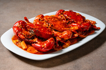 Crab sauce padang (Indonesian Kepiting Saus Padang). dish of crab served in hot and spicy Padang sauce.