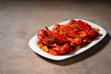 Crab sauce padang (Indonesian Kepiting Saus Padang). dish of crab served in hot and spicy Padang sauce.
