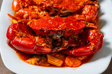 Crab sauce padang (Indonesian Kepiting Saus Padang). dish of crab served in hot and spicy Padang sauce.