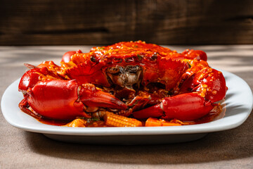 Crab sauce padang (Indonesian Kepiting Saus Padang). dish of crab served in hot and spicy Padang sauce.