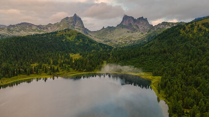 Fototapeta premium the lake is Bright at sunset, filmed from a drone