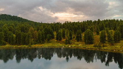 the lake is Bright at sunset, filmed from a drone