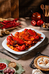 Crab sauce padang (Indonesian Kepiting Saus Padang). dish of crab served in hot and spicy Padang sauce.