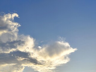 Beautiful blue sky with fluffy white clouds on a sunny day