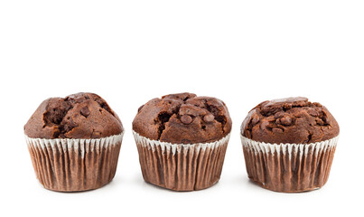 Chocolate chip muffins in a row on white background.