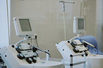 Advanced medical monitors and devices in hospital ward showcasing sterile environment and technical...