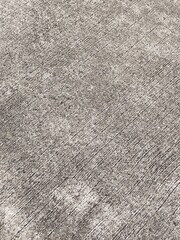 Old weathered concrete wall with rough textured gray surface and vintage grunge design