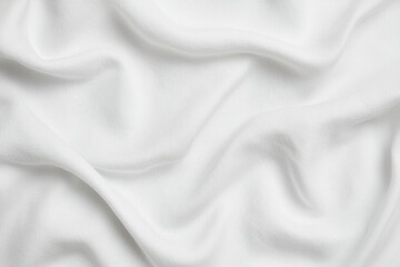 Soft, flowing white fabric draped elegantly, showcasing texture and subtle movement for artistic and design projects.