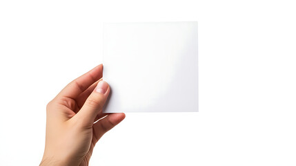 Blank square sheet of paper held in hand on white background