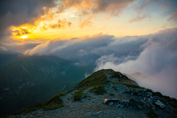 Colorful, clouded sunset in the mountains