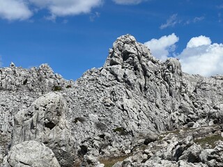 Rocky ridge of Tulove grede or karst mountain peak of Tulovice - Velebit Nature Park, Croatia (Stjenoviti greben Tulove grede ili krški planinski vrh Tulovice - Park prirode Velebit, Hrvatska)