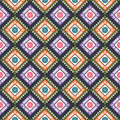 geometric pattern with diamond shapes. Each diamond contains a central circle with a floral design, alternating in colors of pink and teal. symmetrical and vibrant, creating a visually striking.