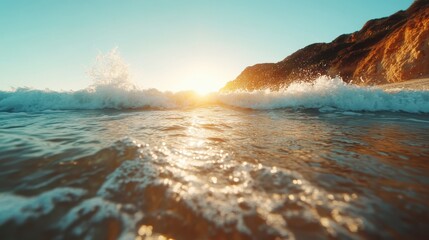 An ocean sunset scene with waves gently crashing onto a rocky shoreline, capturing the vivid colors and dynamic movement of the sea during a calm evening.