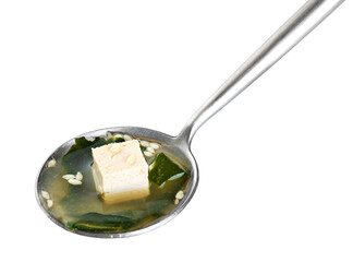 Seaweed soup with tofu on a spoon isolated on white background. With clipping path.