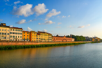 Naklejka premium Summer sunset landscape of Pisa old city and the embankment of Arno river, Italy, Europe