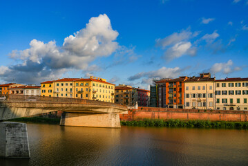 Fototapeta premium Summer sunset landscape of Pisa old city and the embankment of Arno river, Italy, Europe 