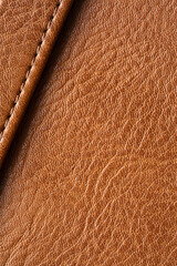 Brown synthetic leather macro background,Synthetic leather brown background texture. Brown leather textured background.