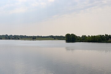 The calm lake on a sunny morning.