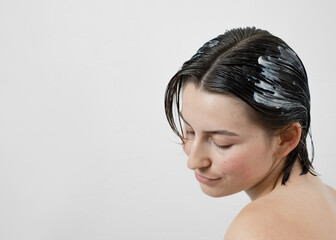 Nourishing hair mask applied to wet hair.